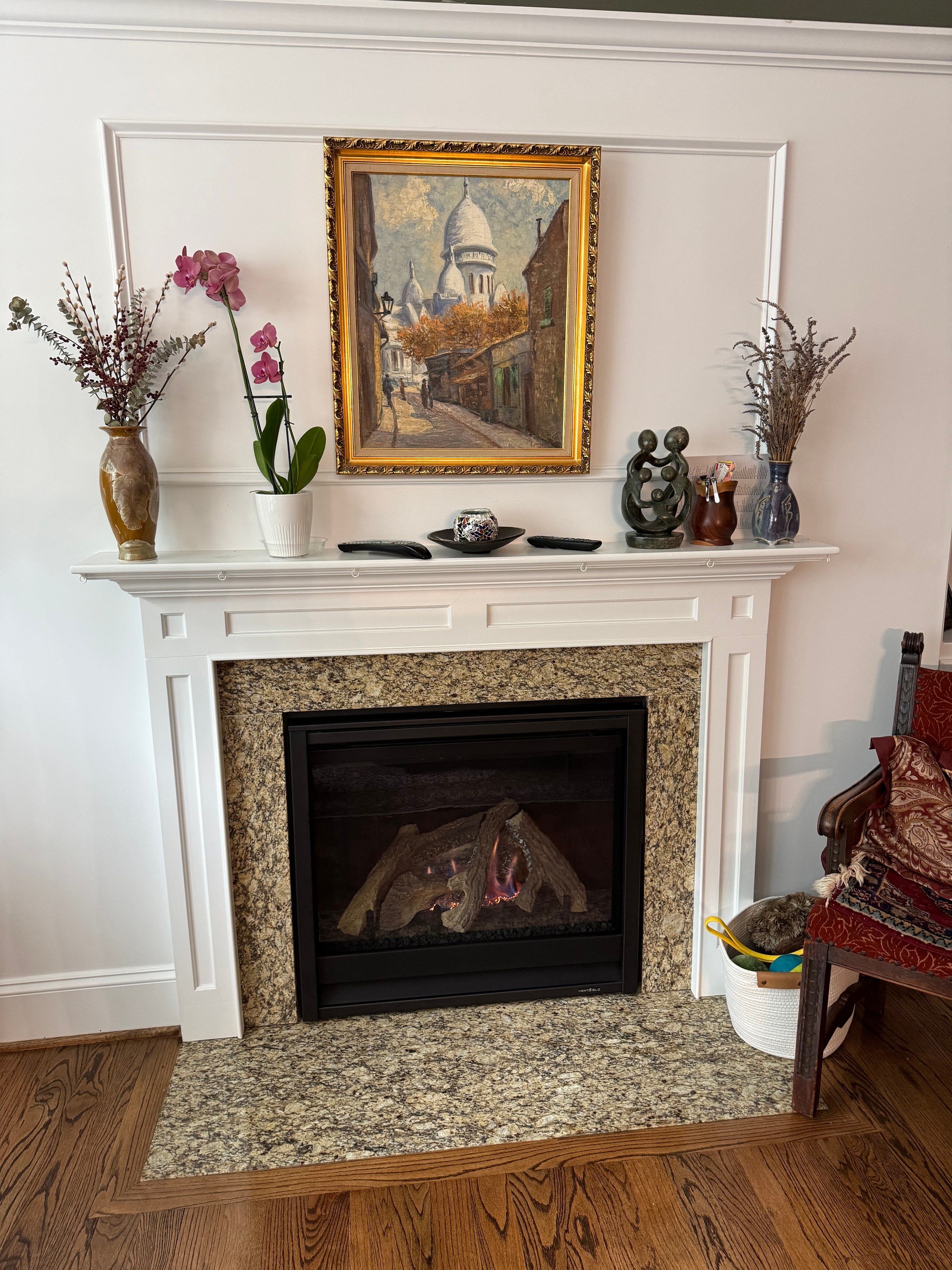 Gas fireplace with granite surround and white mantel — service completed by Gas Log Works
