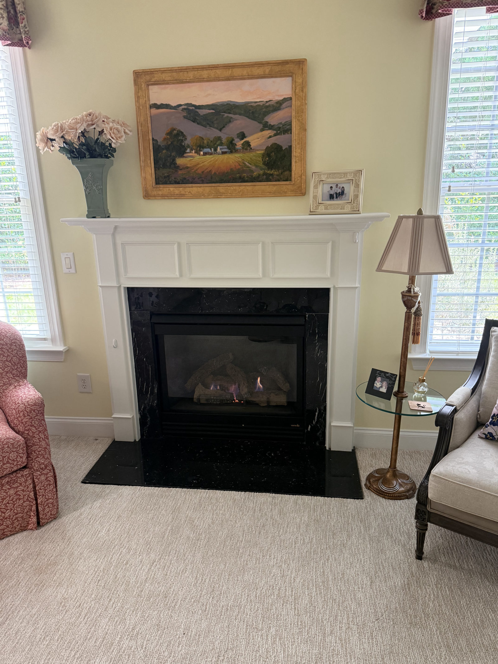 Annual service on a Superior direct vent gas fireplace in Holly Springs, NC — yellow walls, flowers on mantel