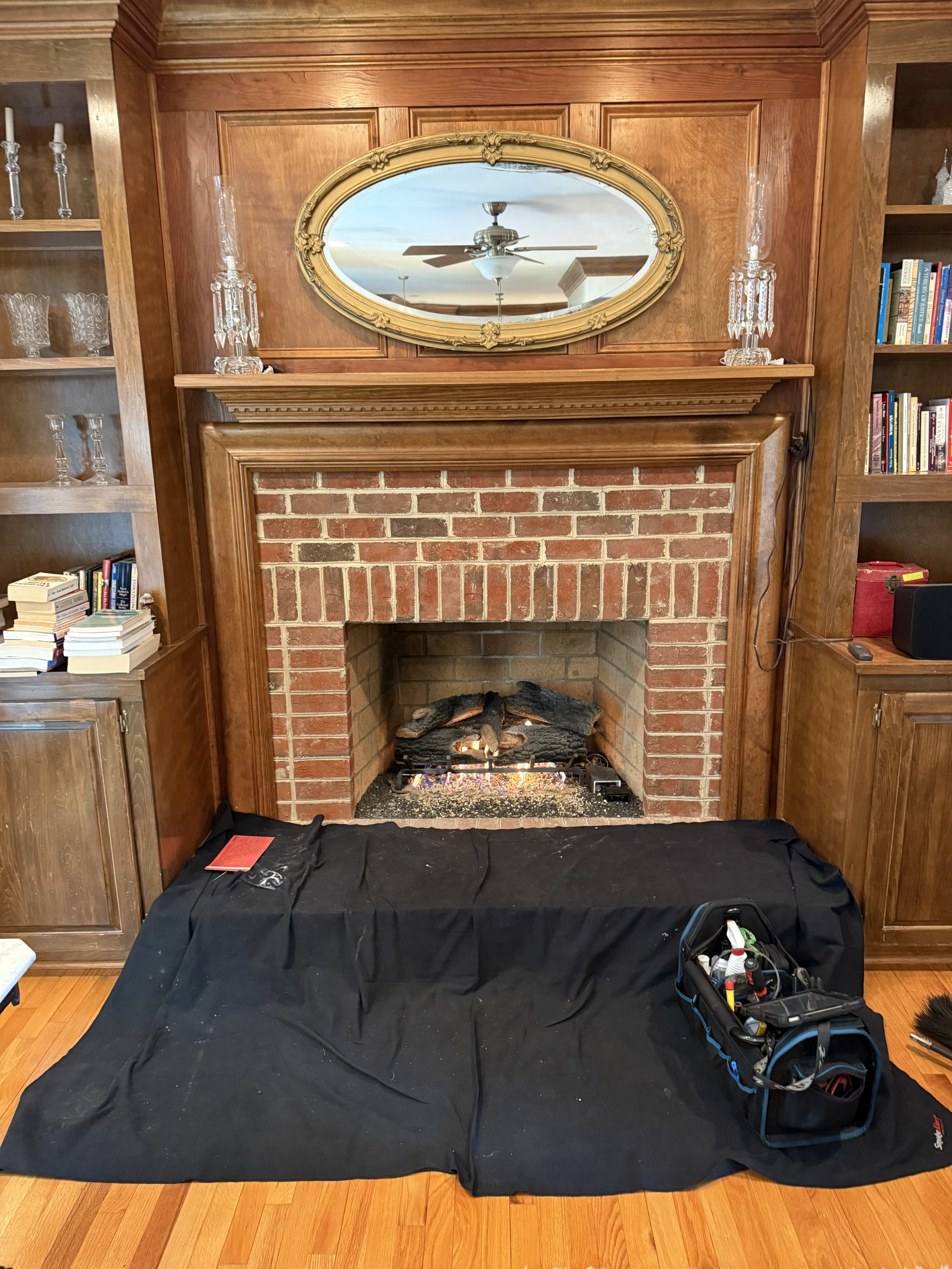 Brick fireplace with wood mantel — Real-Fyre gas log set service in North Raleigh, NC